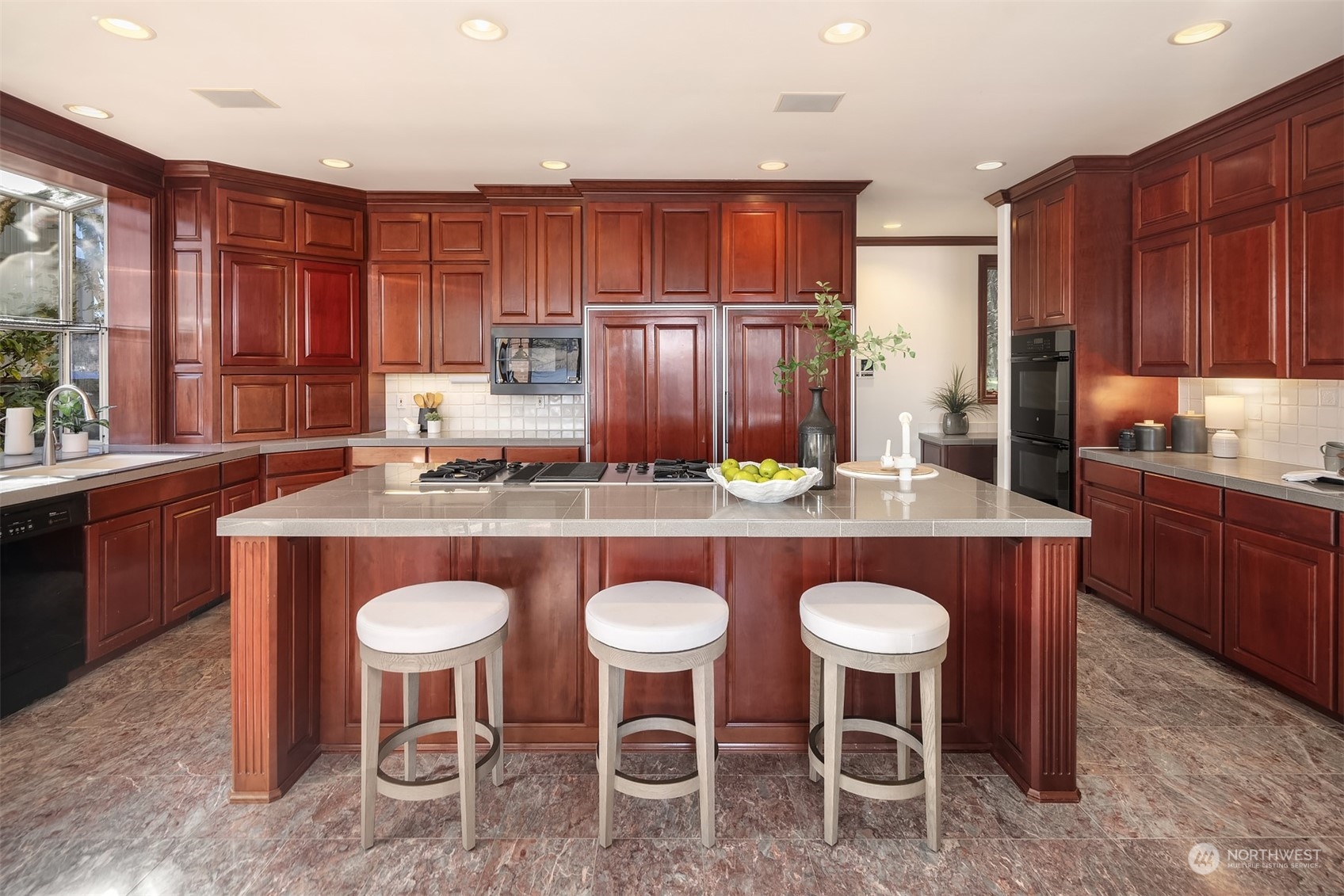 4452 Ferncroft Road Mercer Island, WA 98040 - Photo 14 of 39 a kitchen with granite countertop a table chairs stove and refrigerator