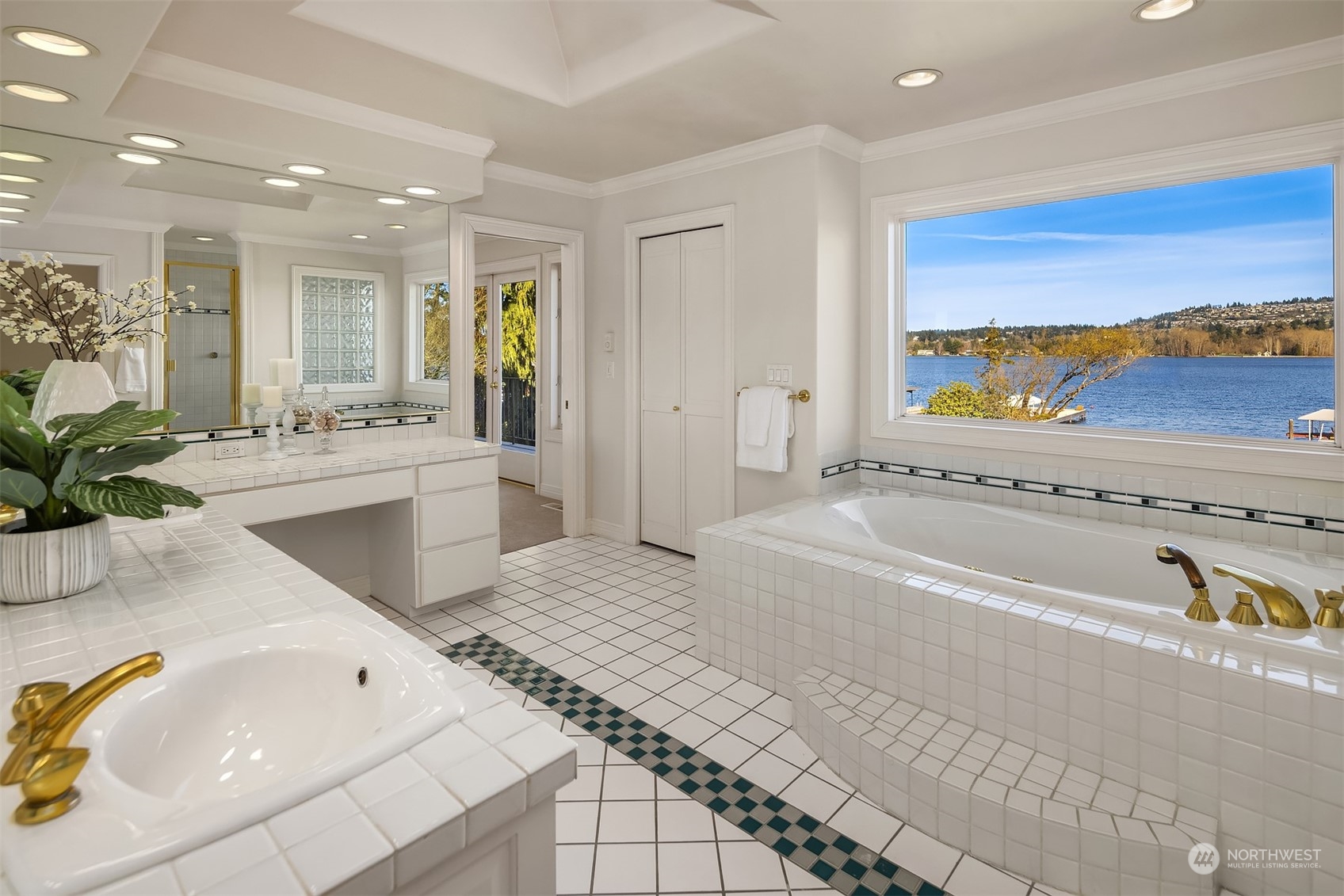 4452 Ferncroft Road Mercer Island, WA 98040 - Photo 25 of 39 a spacious bathroom with a tub a sink and a large window