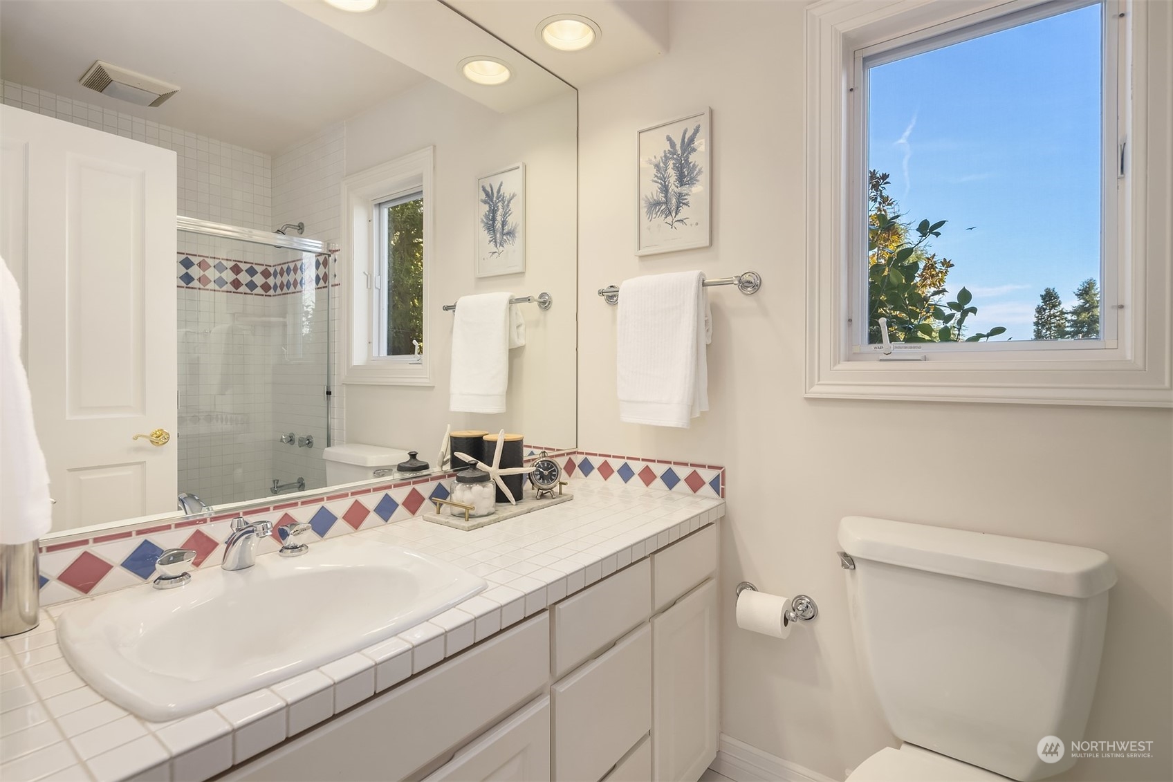 4452 Ferncroft Road Mercer Island, WA 98040 - Photo 30 of 39 a bathroom with a sink and a mirror