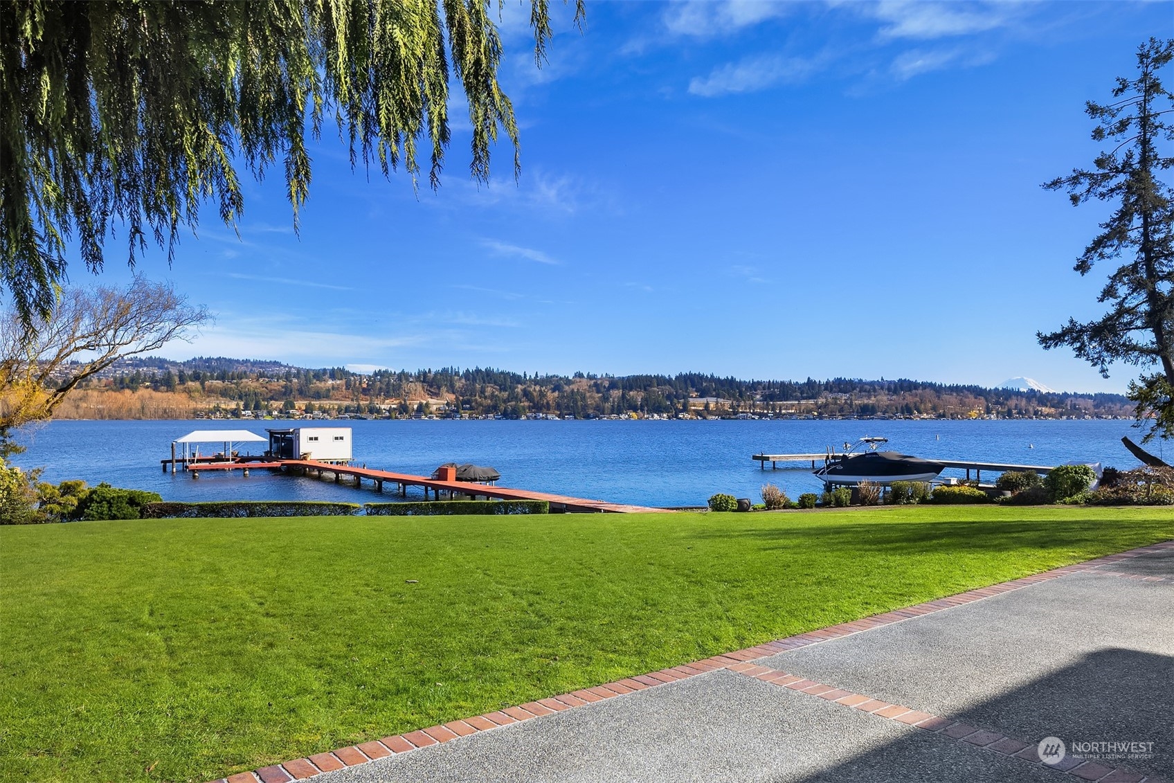 4452 Ferncroft Road Mercer Island, WA 98040 - Photo 3 of 39 a view of a lake with a building in the background