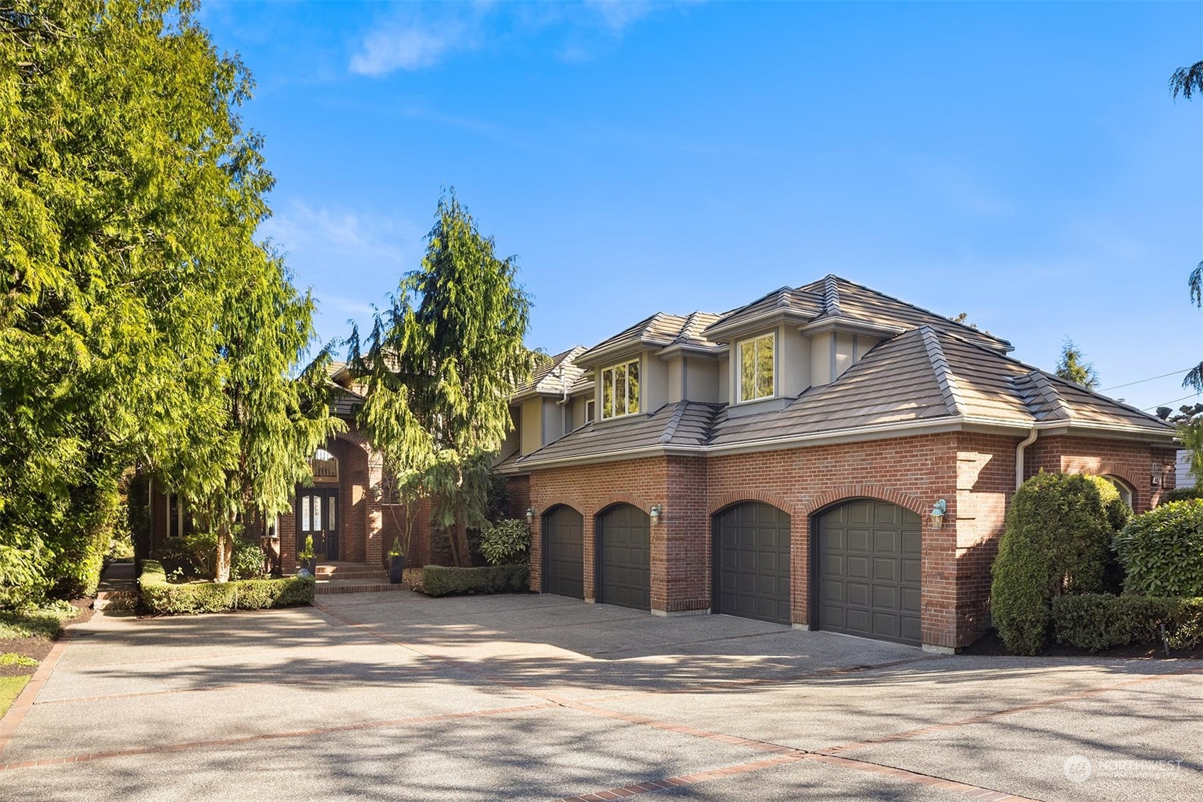 4452 Ferncroft Road Mercer Island, WA 98040 - Photo 5 of 39 a front view of a house with a yard