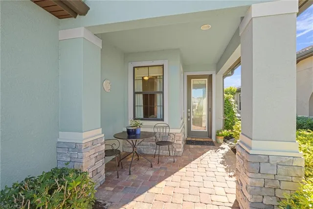 a bathroom with a granite countertop sink a mirror and shower