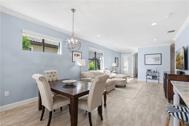 a kitchen with a sink window and cabinets