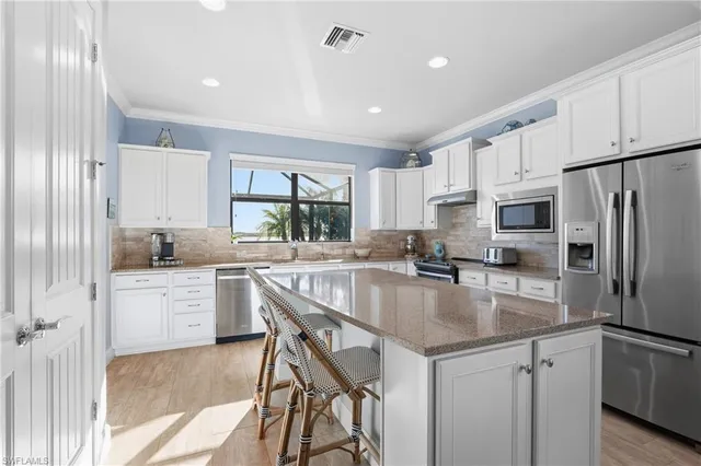 a bedroom with a large bed and a tv