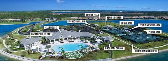 an aerial view of a residential houses with outdoor space and ocean view