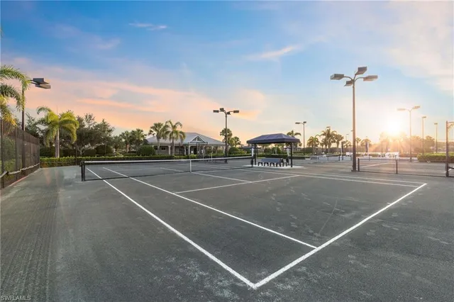 a dining hall with lots of tables and chairs