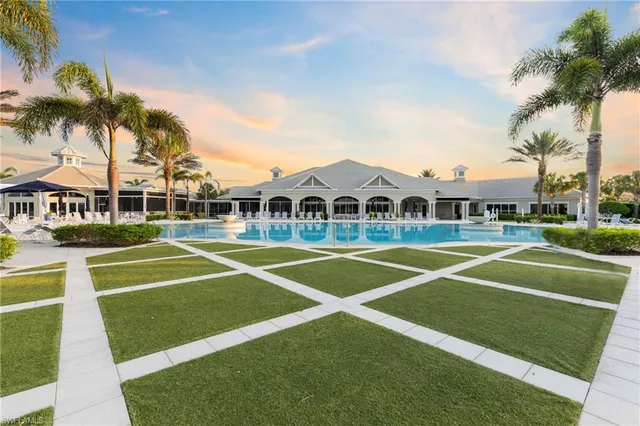 a view of a backyard with swimming pool