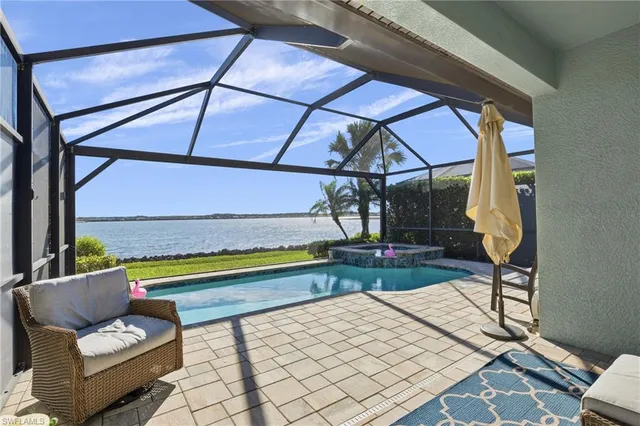 a view of a house with backyard porch and sitting area