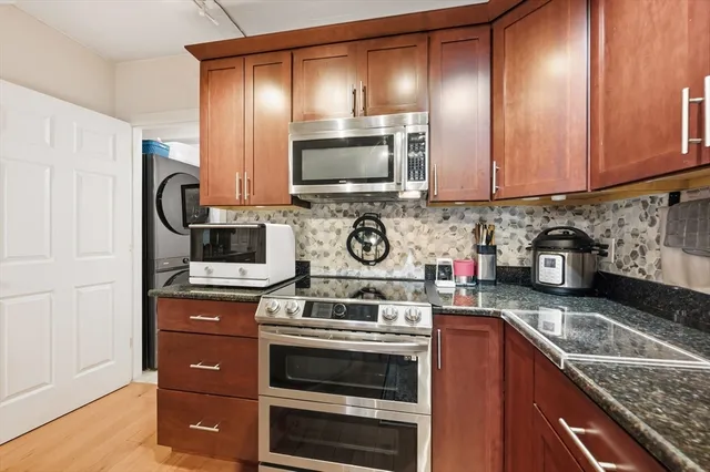 a kitchen with sink and cabinets