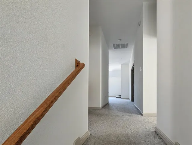 a bathroom with a sink a toilet a mirror and shower