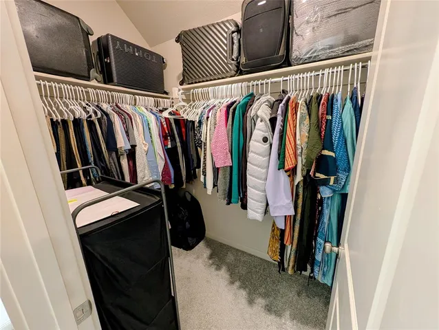 a bathroom with a toilet sink and shower