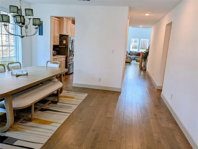 a room with wooden floor and furniture