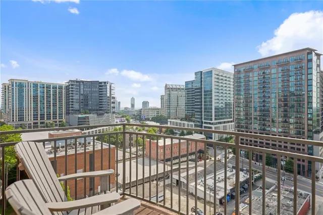 a view of balcony with wooden floor