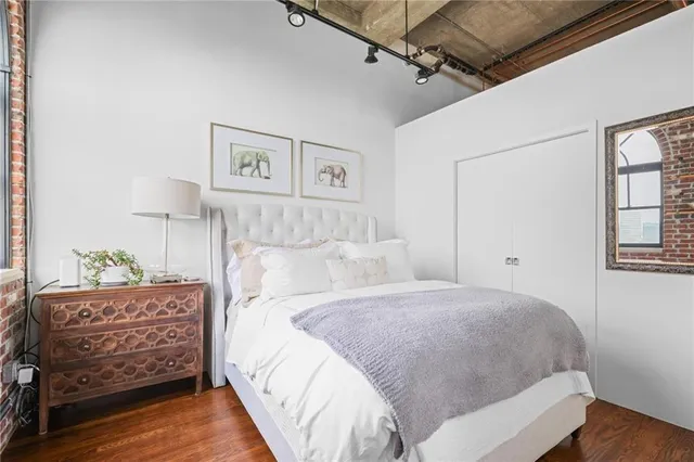 a bedroom with a bed and a dresser