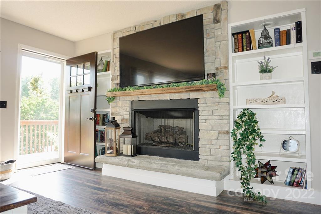 516 Starview Drive Rutherfordton, NC 28139 - Photo 25 of 47 a living room with furniture a flat screen tv and a fireplace