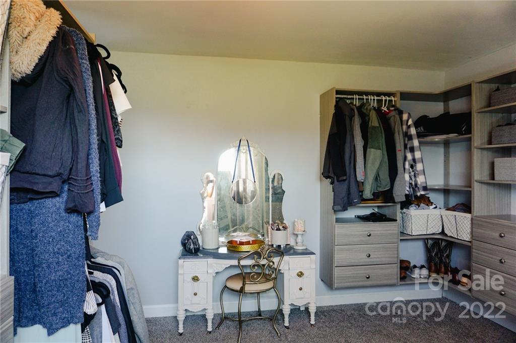 516 Starview Drive Rutherfordton, NC 28139 - Photo 36 of 47 a view of walk in closet with clothes and shoes