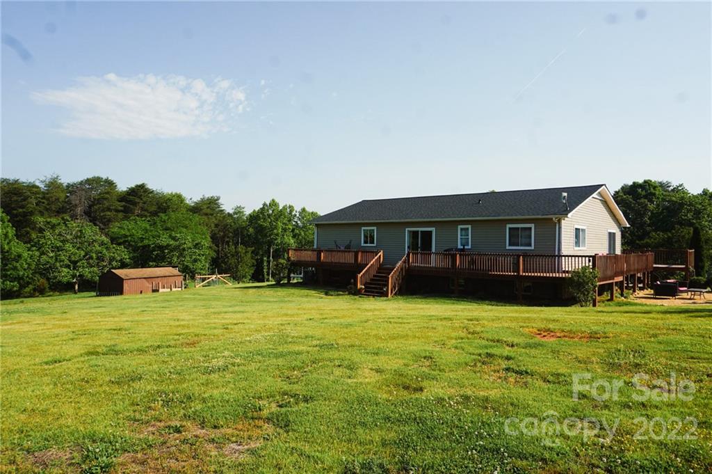 516 Starview Drive Rutherfordton, NC 28139 - Photo 4 of 47 a backyard of a house with table and chairs