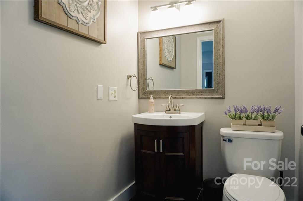 516 Starview Drive Rutherfordton, NC 28139 - Photo 42 of 47 a bathroom with a toilet sink and mirror