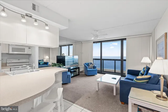 a kitchen with a stove a sink and a refrigerator