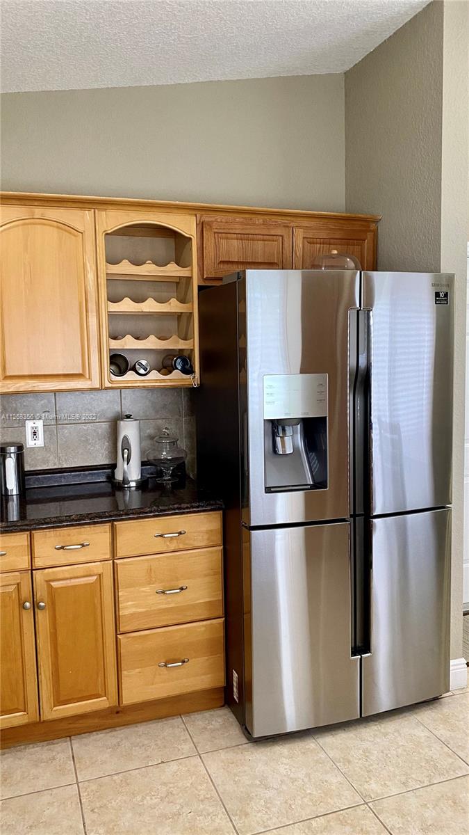 20309 Southwest 86th Court Cutler Bay, FL 33189 - Photo 15 of 59 a kitchen with appliances a refrigerator and a sink