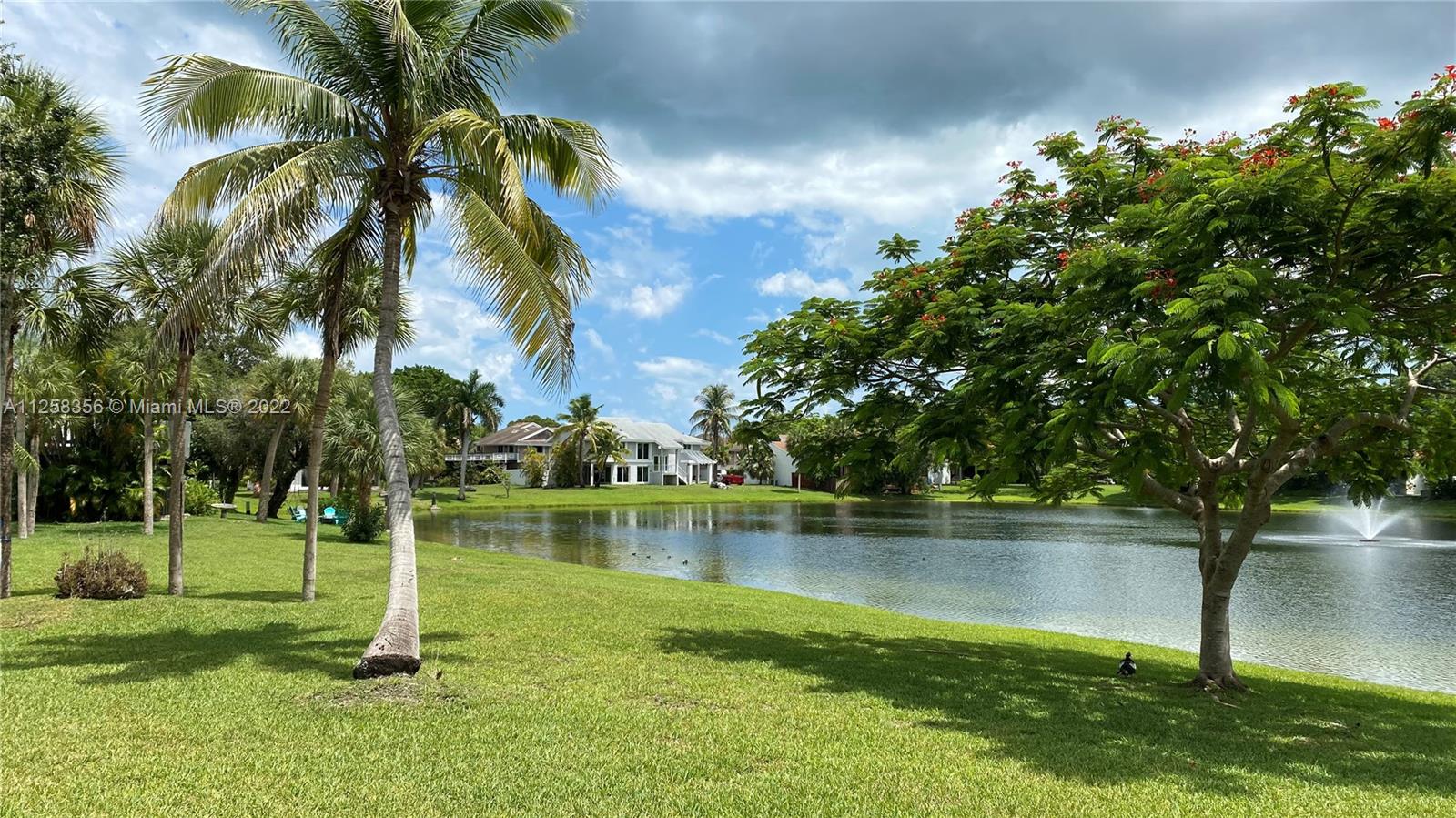 20309 Southwest 86th Court Cutler Bay, FL 33189 - Photo 2 of 59 a view of a lake with a big yard