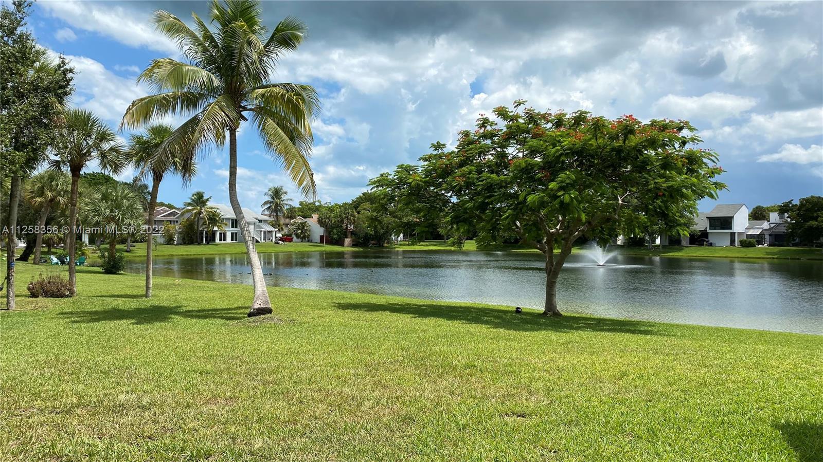 20309 Southwest 86th Court Cutler Bay, FL 33189 - Photo 30 of 59 a view of a lake with a house