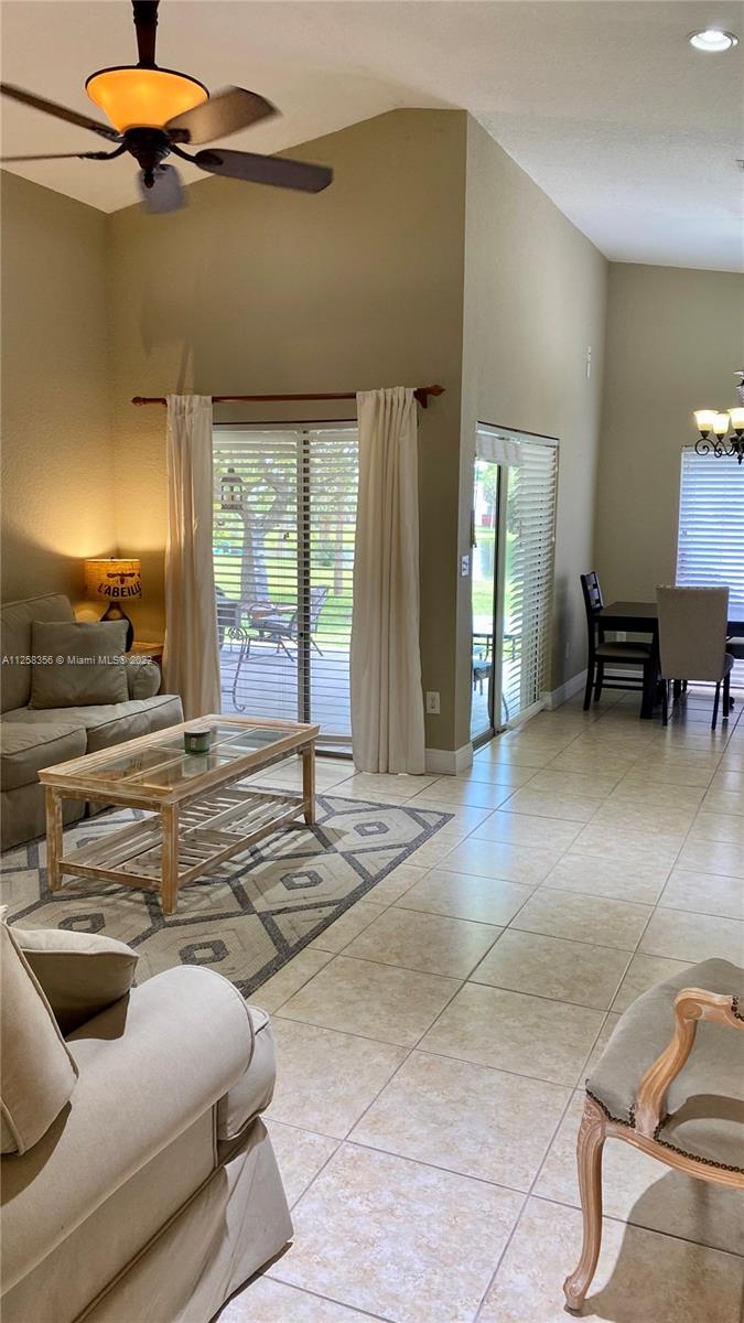 20309 Southwest 86th Court Cutler Bay, FL 33189 - Photo 4 of 59 a view of a livingroom with furniture and windows