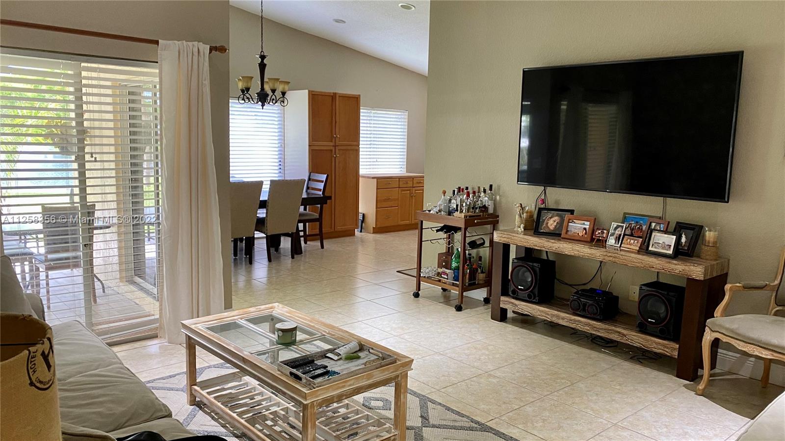 20309 Southwest 86th Court Cutler Bay, FL 33189 - Photo 5 of 59 a living room with furniture and a flat screen tv