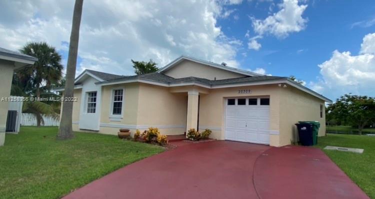 20309 Southwest 86th Court Cutler Bay, FL 33189 - Photo 59 of 59 a front view of a house with garden
