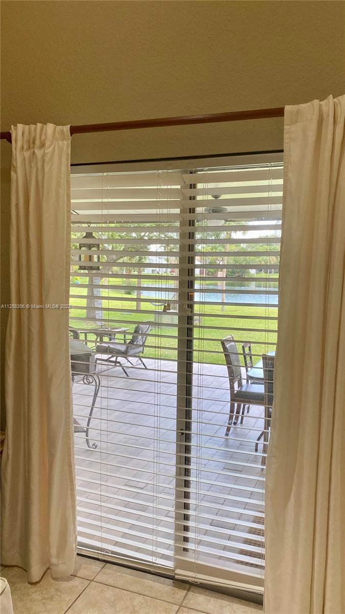 20309 Southwest 86th Court Cutler Bay, FL 33189 - Photo 8 of 59 a view of a room with a table and chairs