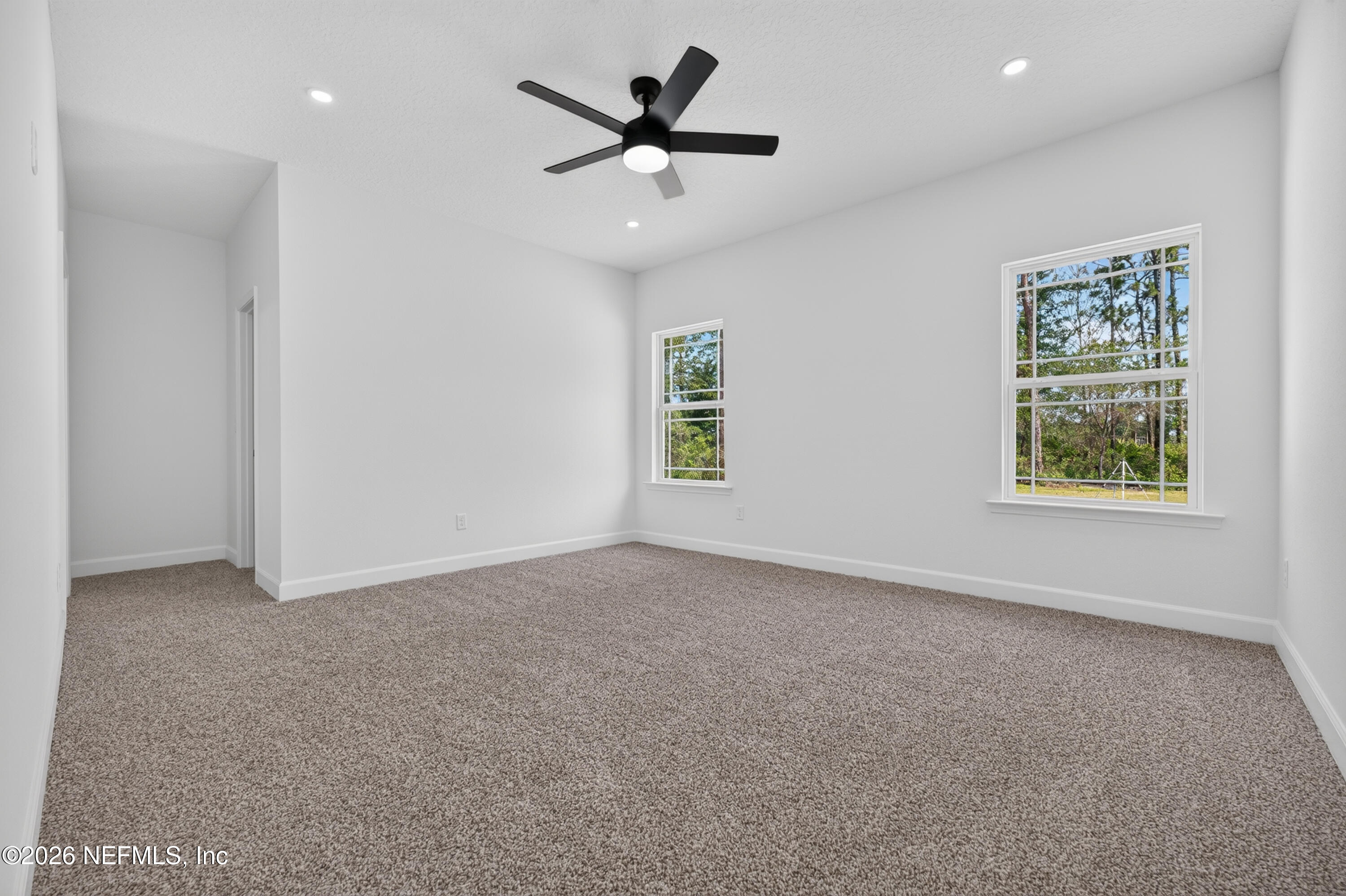 4362 Angora Street Middleburg, FL 32068 - Photo 10 of 31 an empty room with windows and ceiling fan