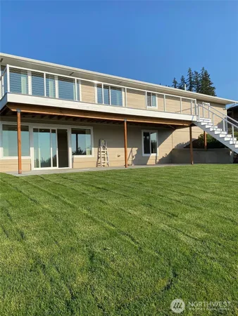a front view of a house with a yard