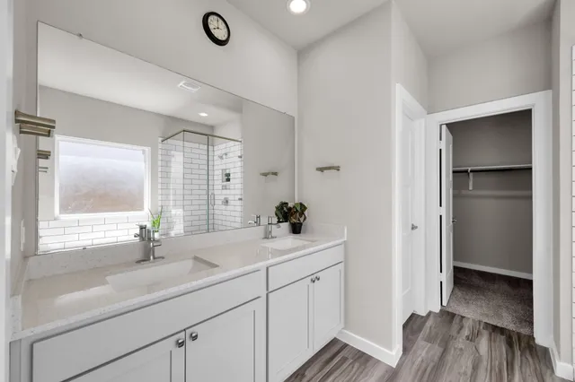 a bathroom with a sink and a large mirror