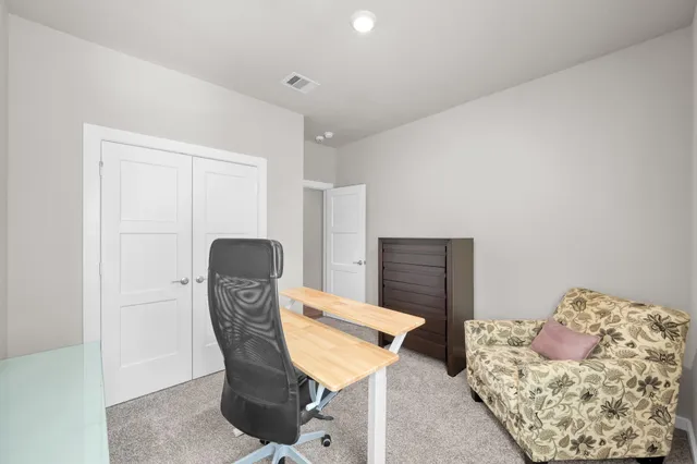 a view of a livingroom with furniture