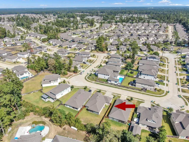 an aerial view of residential houses with outdoor space