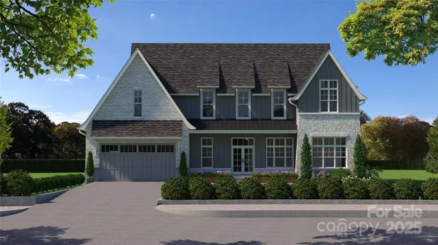 a view of a house with brick walls and a yard with plants