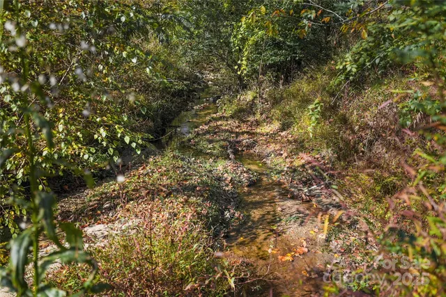 an aerial view of a golf course with sign board