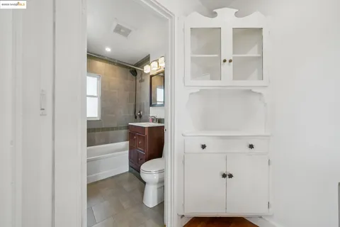 a bathroom with a toilet sink and shower