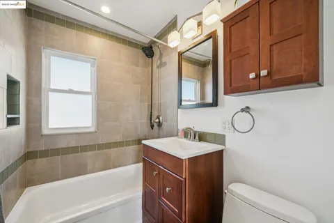 a bathroom with a sink a toilet and a bathtub