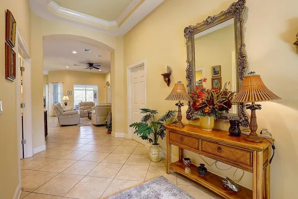 a view of living room with furniture and a mirror
