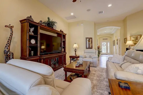 a living room with furniture and a large window