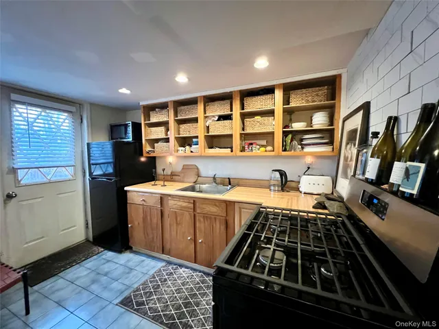 a kitchen with a stove and a refrigerator