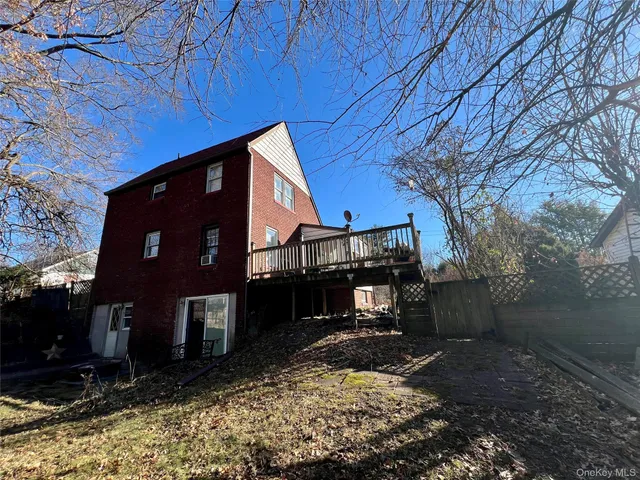 a view of house with yard