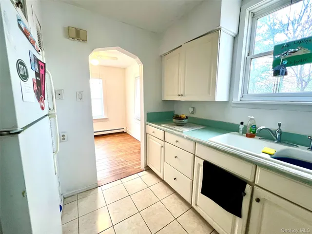 a kitchen with stainless steel appliances a stove a sink and a refrigerator
