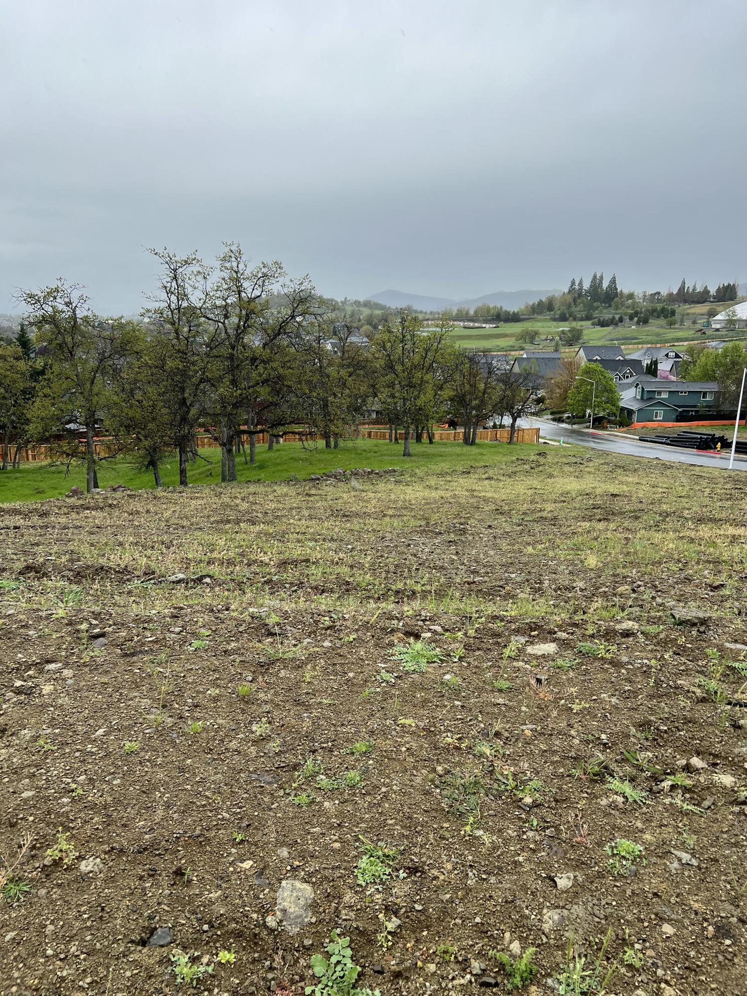 481 Quail Hollow, Unit 92 Eagle Point, OR 97524 - Photo 2 of 7 a view of a field with an trees