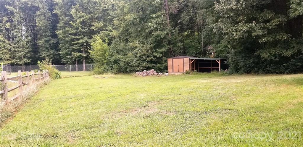 1202 West Rebound Road Lancaster, SC 29720 - Photo 14 of 14 a swimming pool with big trees