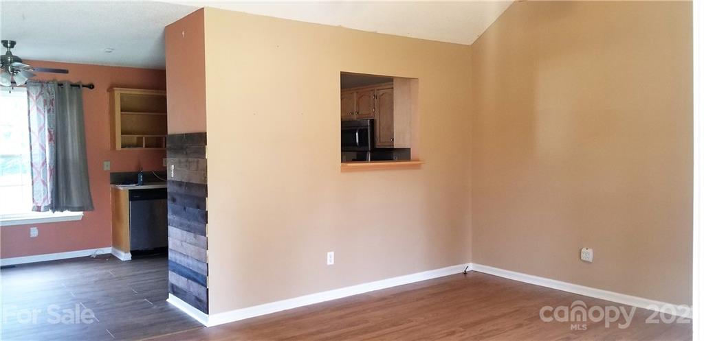 1202 West Rebound Road Lancaster, SC 29720 - Photo 3 of 14 an empty room with wooden floor and a window
