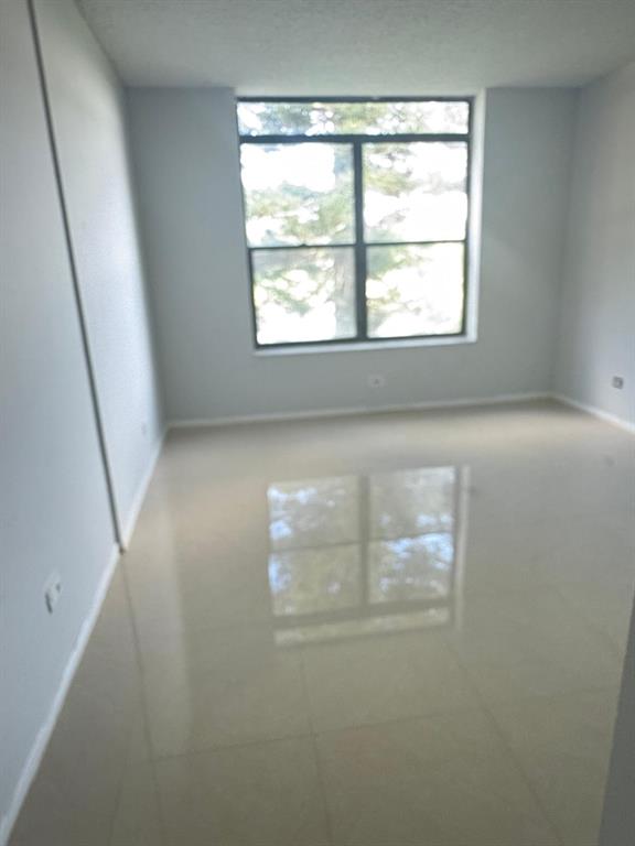3760 Inverrary Drive, Unit 2H Lauderhill, FL 33319 - Photo 22 of 23 an empty room with a window