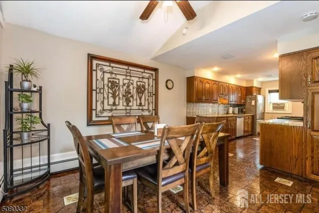 a dining room with furniture and window