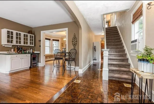 a view of dining room with furniture and wooden floor